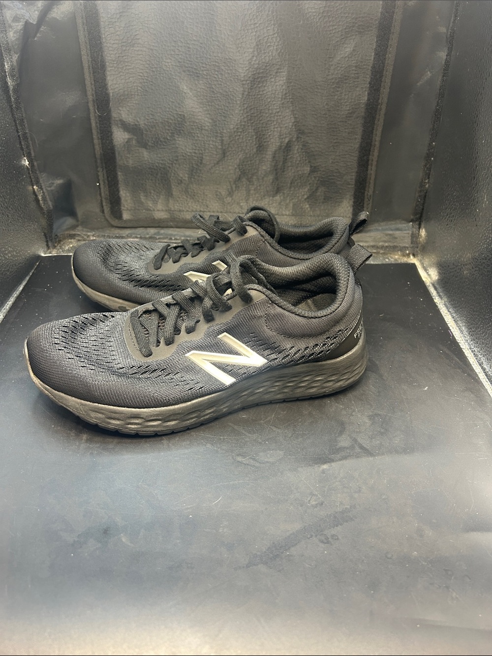 New Balance Men's Black Athletic Running Sneakers with Silver Logo